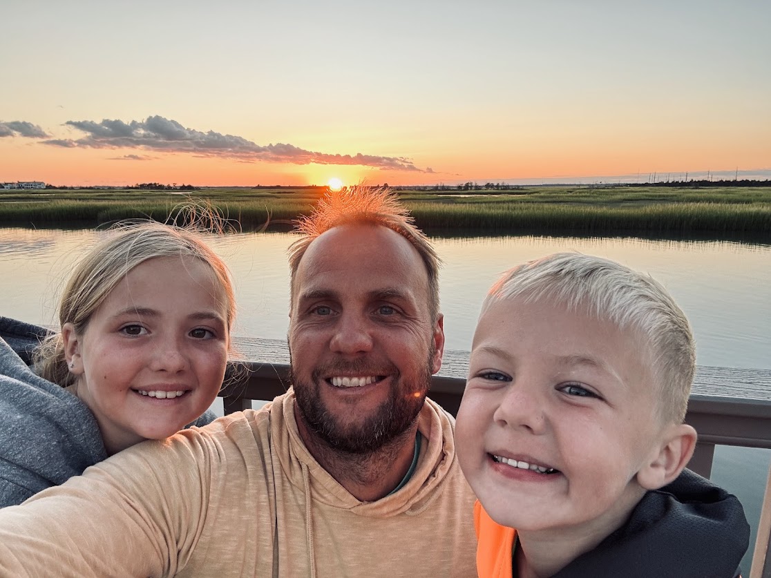 Matt with kids at sunset
