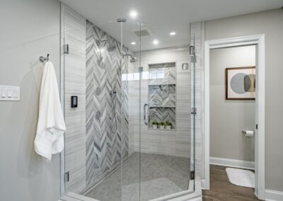 Downingtown luxury master bathroom with herringbone tile shower and large vanity