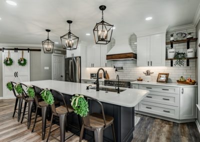 Downingtown farmhouse kitchen remodel with dark island and pendant lights