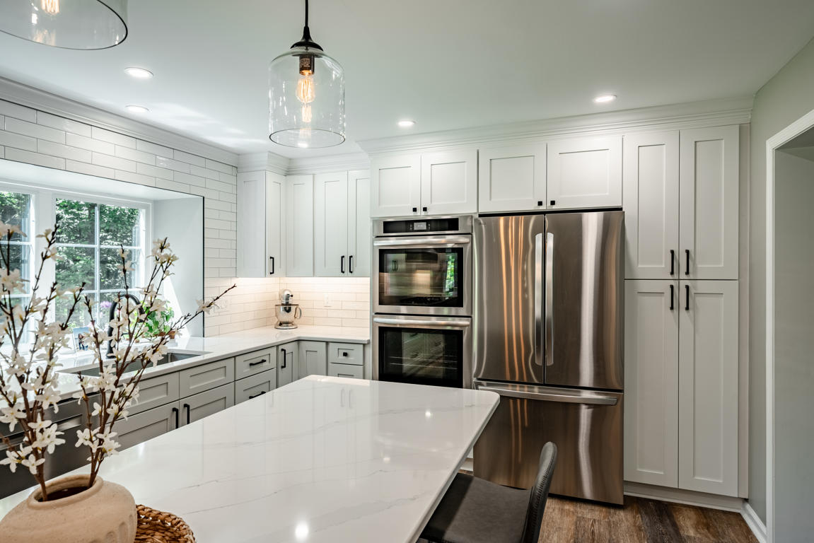 Stainless steel appliances and white quartz countertops in Chester County kitchen renovation