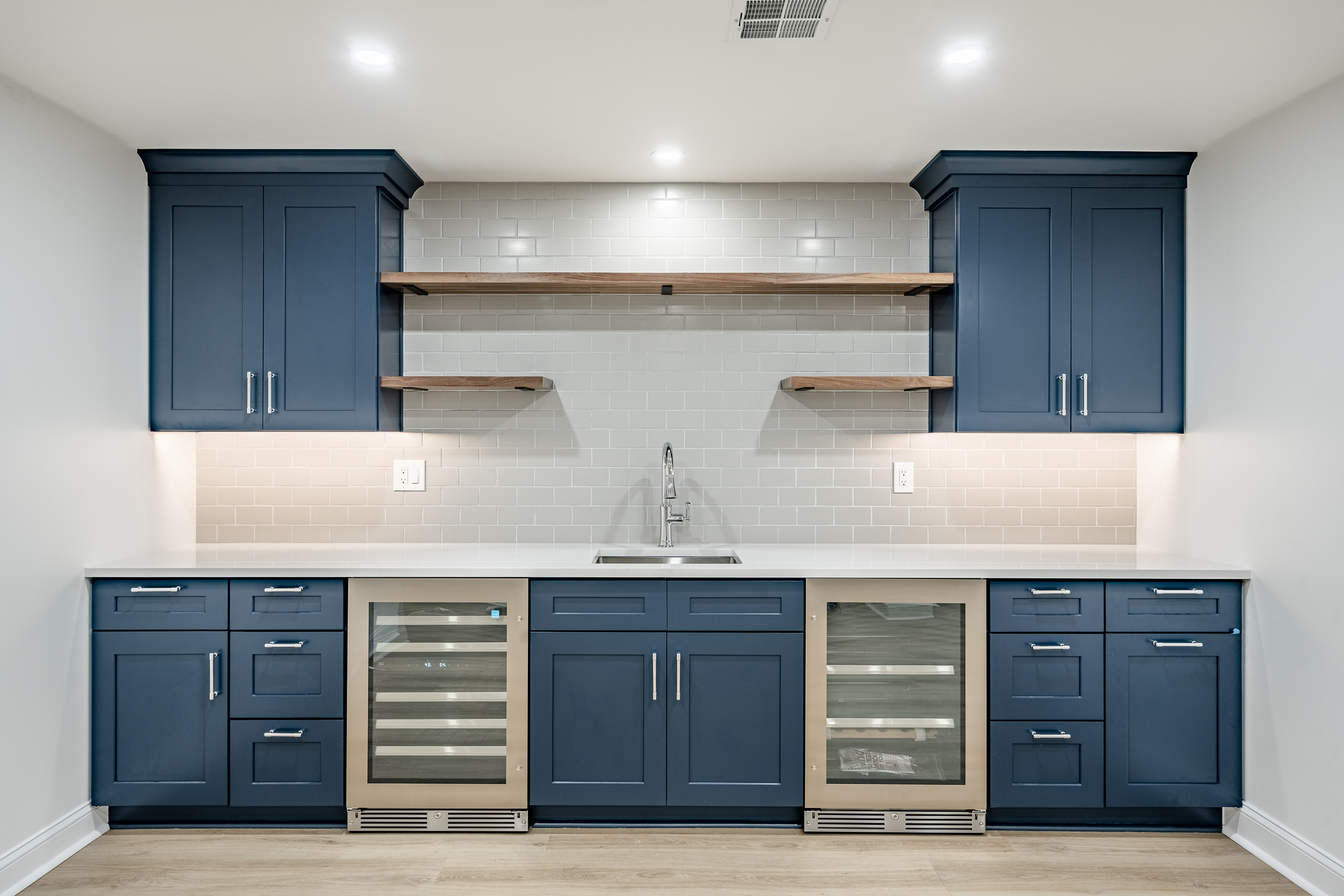 Newtown Square basement wet bar with navy cabinets