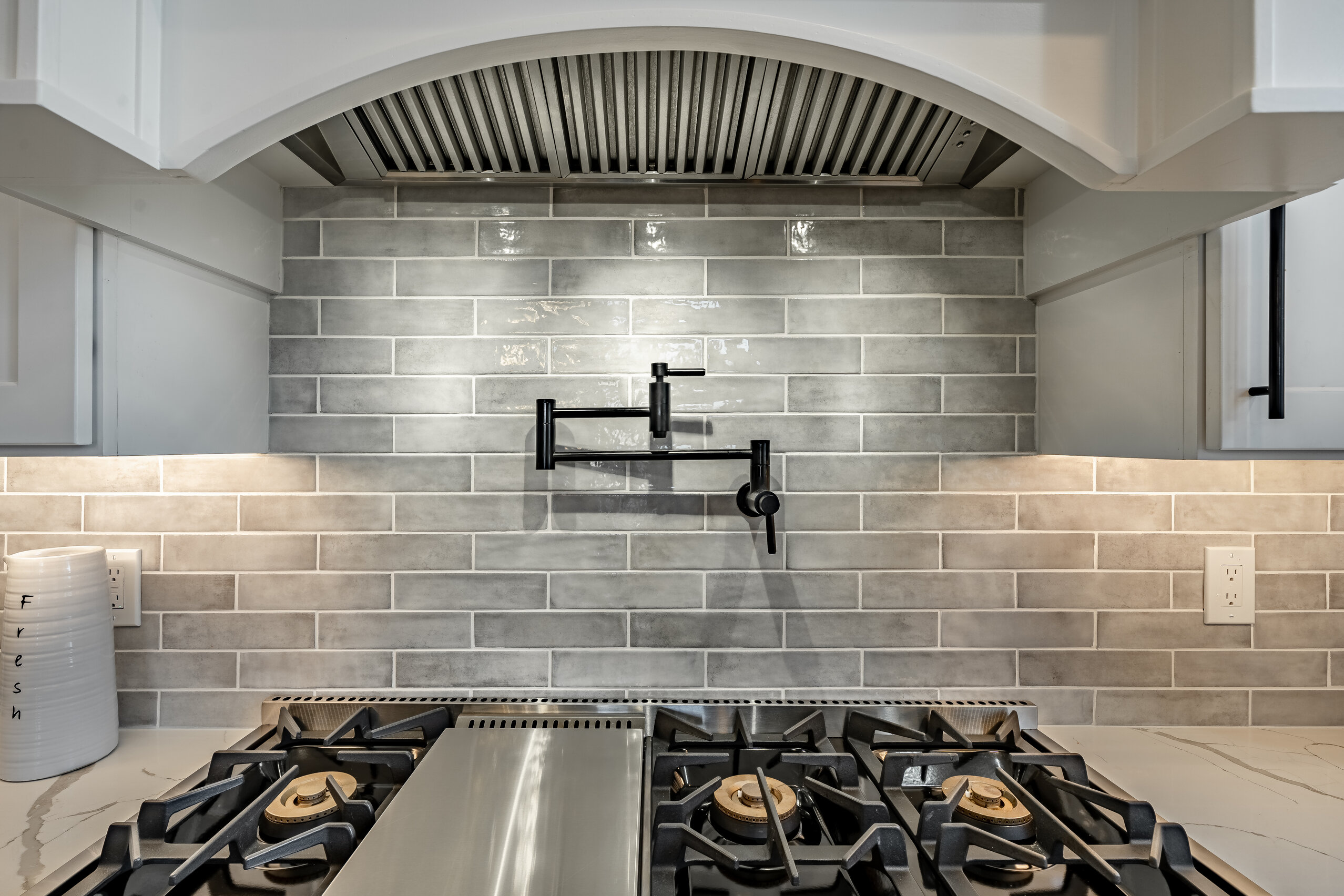 West Brandywine kitchen custom range hood with pot filler and glazed tile backsplash