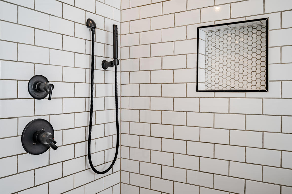 Bathroom layout overview showing the relationship between shower enclosure, pony wall partition, and tub alcove