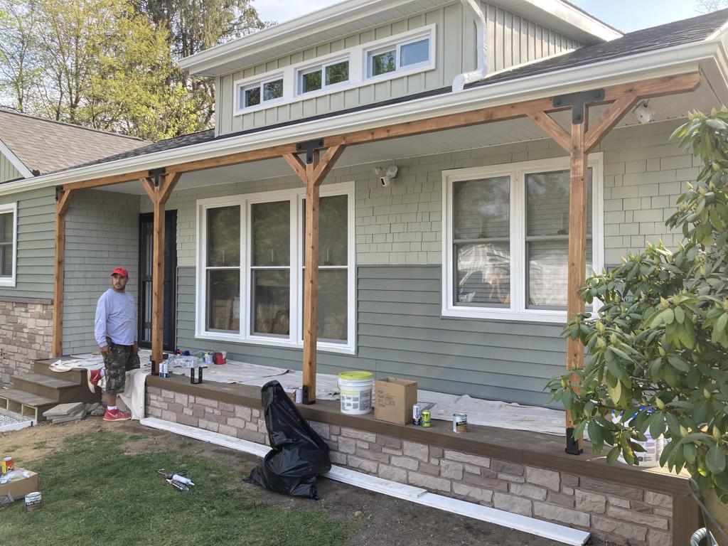 Front porch construction with cedar posts and stone veneer