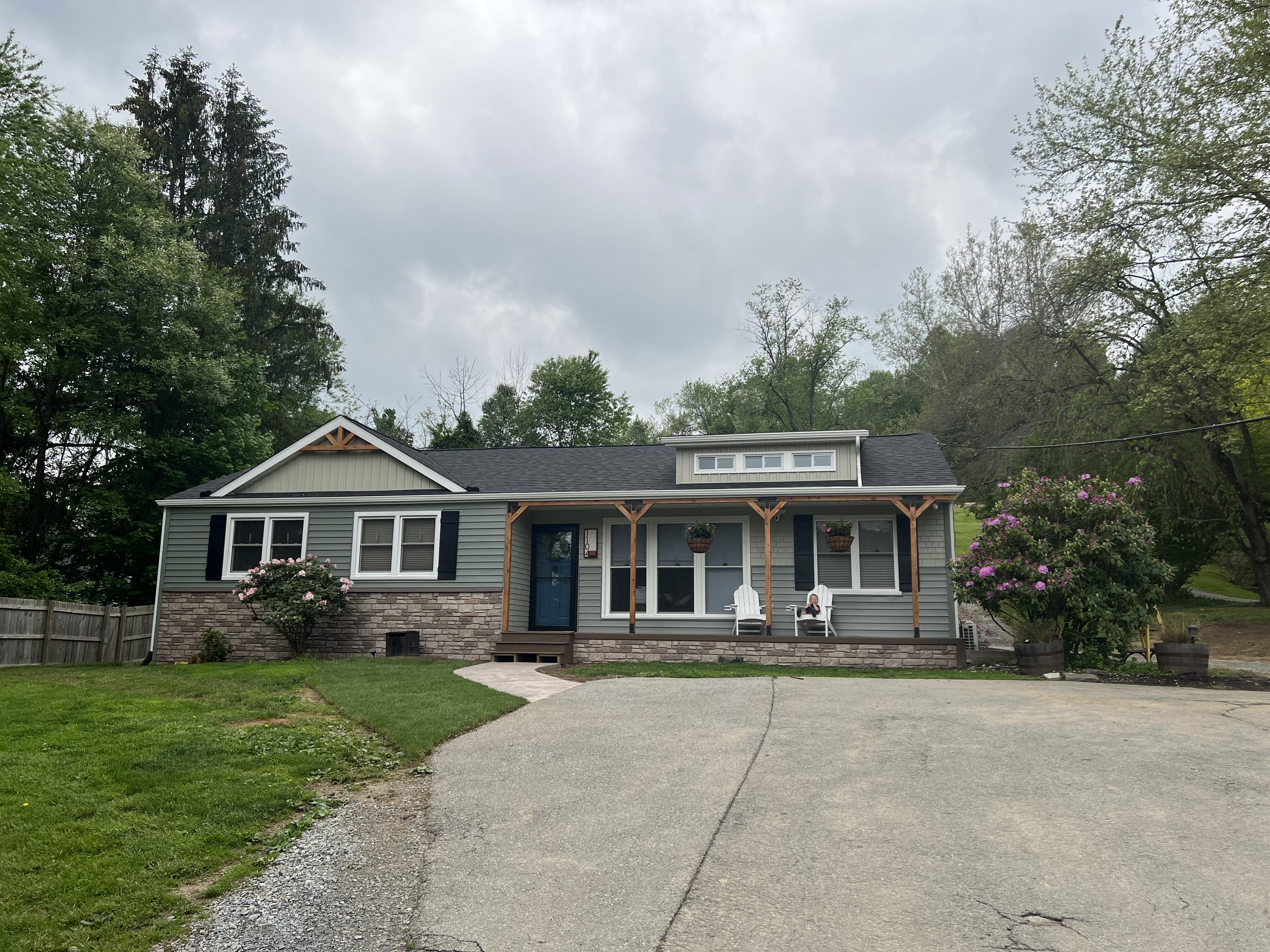 Front view from alternate angle showing new siding and porch