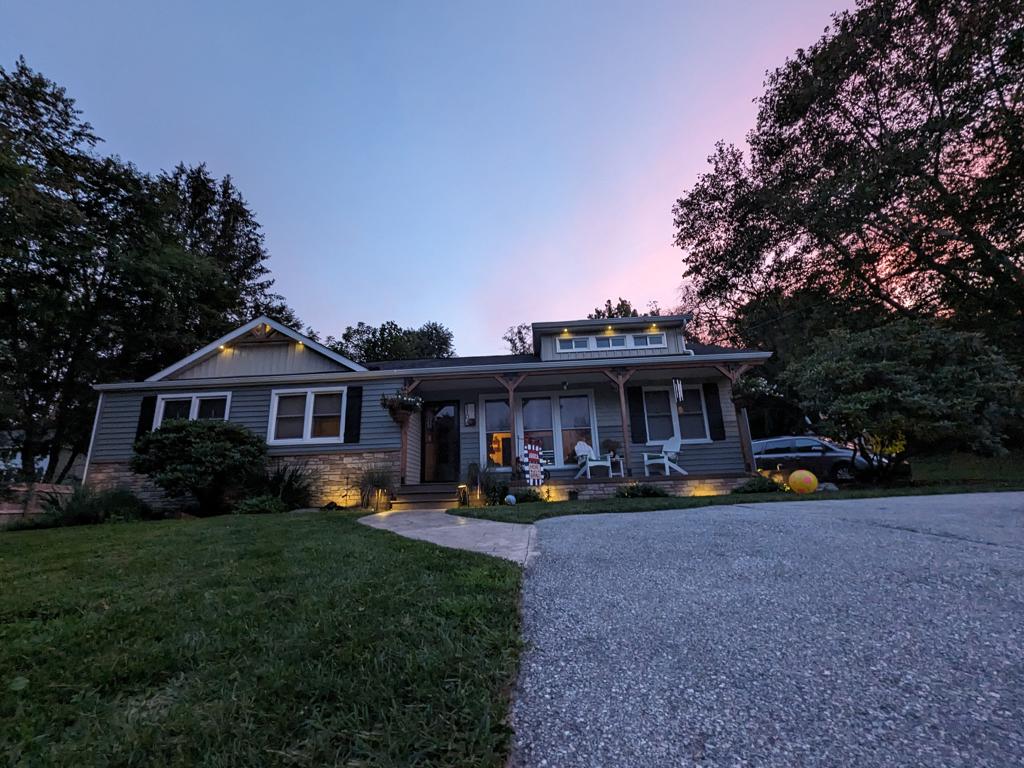 Home at sunset with all landscape lights on